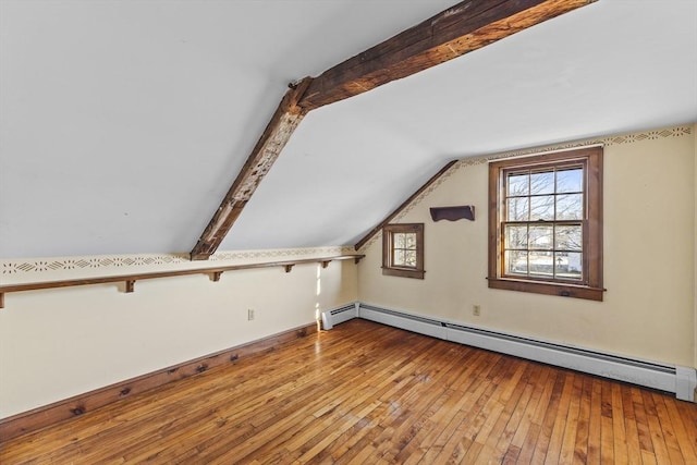 bonus room with wood-type flooring, a baseboard radiator, and vaulted ceiling