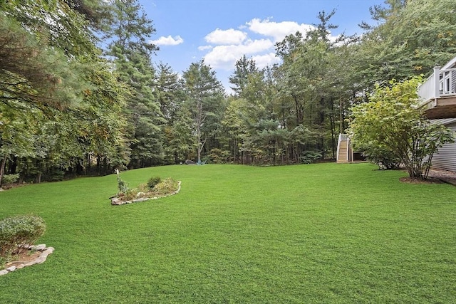 view of yard featuring stairway