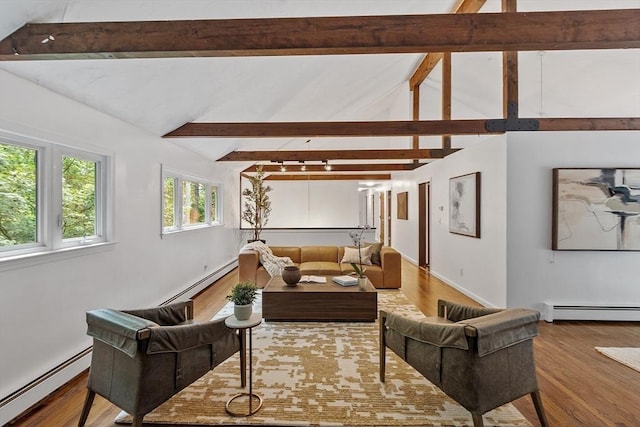 living room with vaulted ceiling with beams, baseboard heating, and wood finished floors