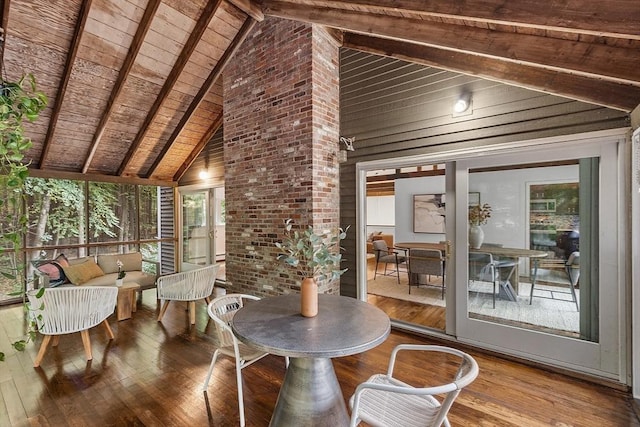 sunroom with vaulted ceiling with beams and wood ceiling