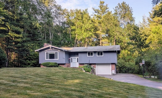 36 Surrey Ln, Sudbury, MA 01776 - bi-level home with driveway, an attached garage, brick siding, and a chimney