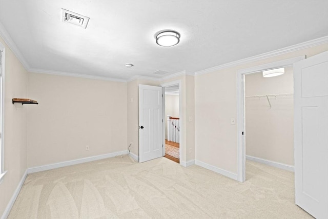 260 Beaver Dam Rd, Scituate, MA 02066 - unfurnished bedroom featuring light colored carpet, a spacious closet, crown molding, and a closet