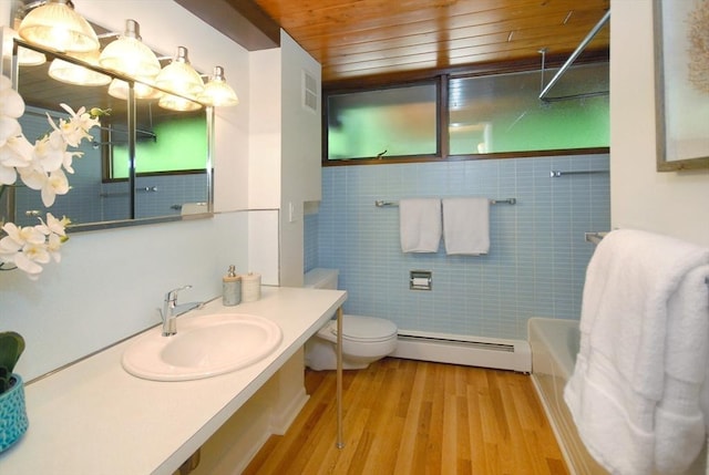 201 Annursnac Hill Rd, Concord, MA 01742 - bathroom featuring a baseboard heating unit, wooden ceiling, wood finished floors, toilet, and vanity