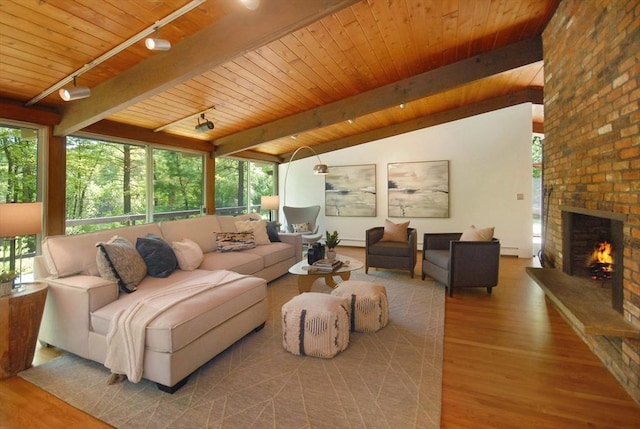 201 Annursnac Hill Rd, Concord, MA 01742 - living room featuring wood finished floors, wood ceiling, track lighting, a brick fireplace, and baseboard heating