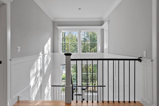 stairs featuring crown molding