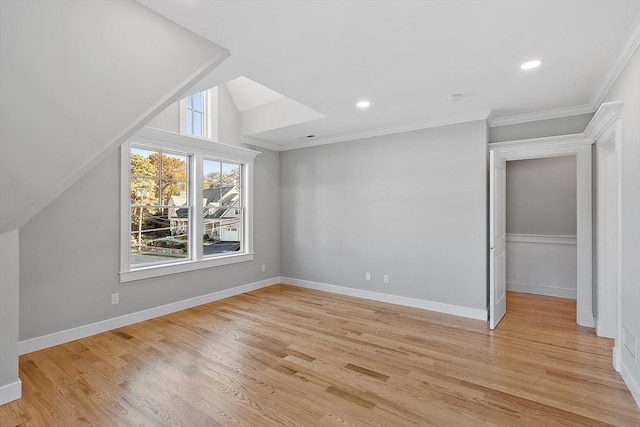 bonus room featuring light wood finished floors, plenty of natural light, and baseboards