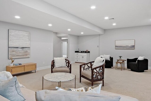 18 Sprague, Wellesley, MA 02481 - living area featuring light carpet, baseboards, visible vents, and recessed lighting
