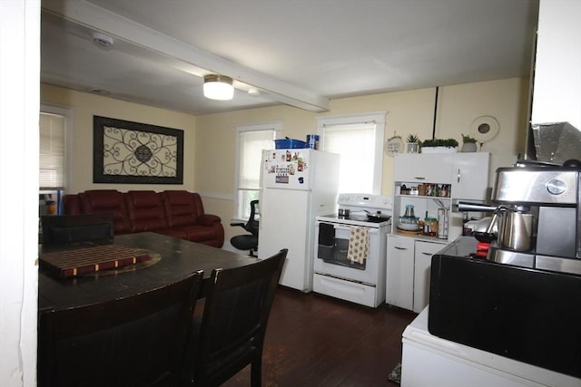 kitchen featuring dark wood finished floors, white cabinets, and white appliances
