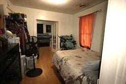 bedroom with wood finished floors