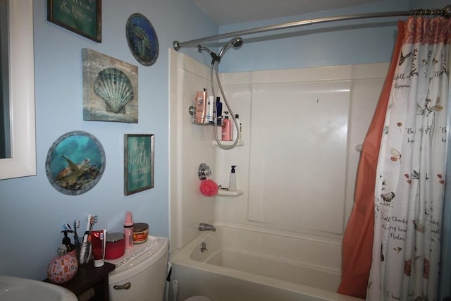 bathroom with shower / bath combo with shower curtain and toilet