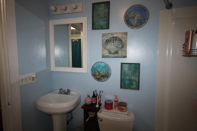 bathroom with a sink and toilet