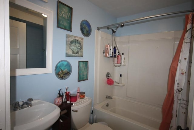 full bathroom with toilet, shower / bath combination with curtain, and a sink