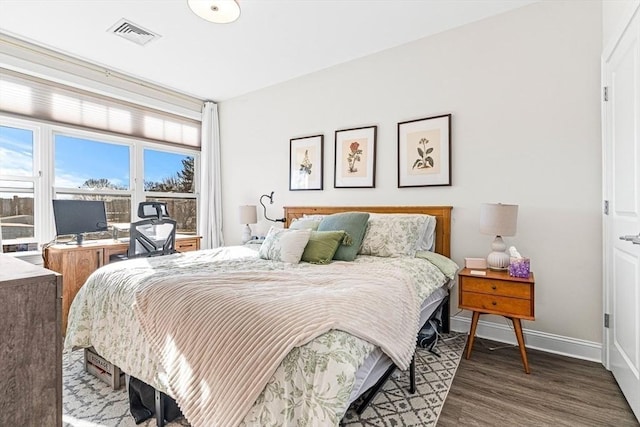 bedroom featuring dark wood-type flooring