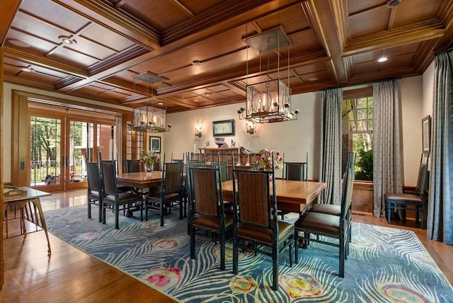 dining room with ornamental molding, plenty of natural light, and a chandelier