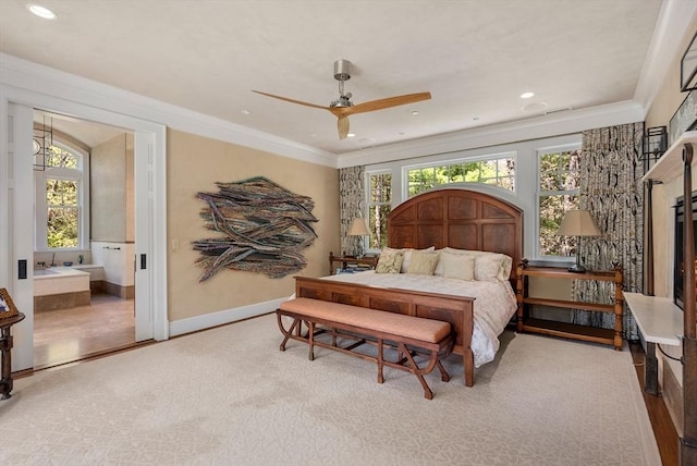 bedroom featuring ceiling fan, ornamental molding, and ensuite bathroom