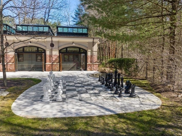 view of home's community featuring a patio area