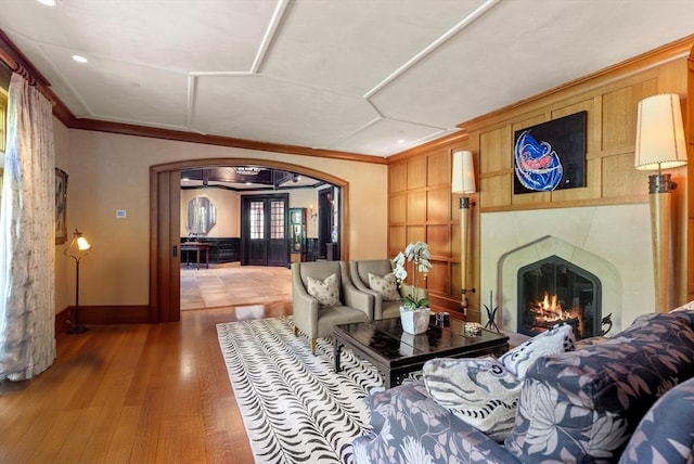 living room featuring ornamental molding and hardwood / wood-style floors