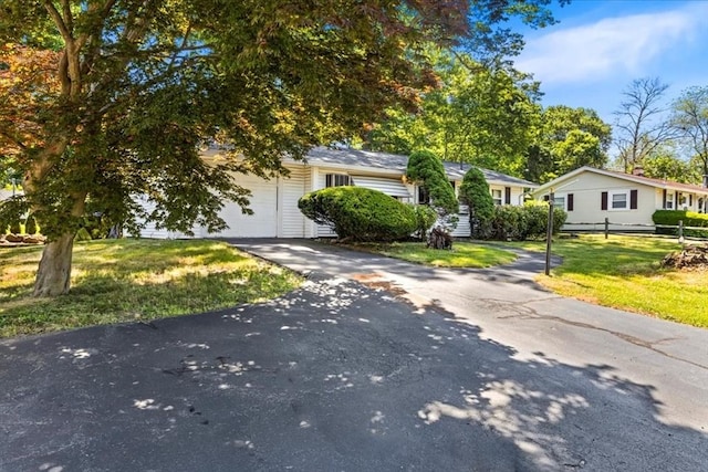 33 Clara Rd, Brockton, MA 02302 - view of front of house with driveway and an attached garage