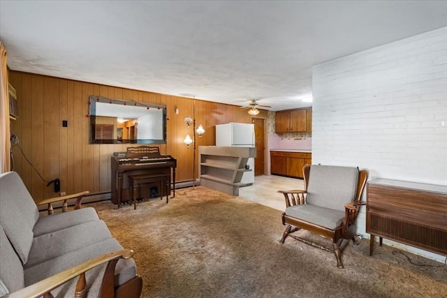 33 Clara Rd, Brockton, MA 02302 - living area with ceiling fan, baseboard heating, wood walls, and light carpet