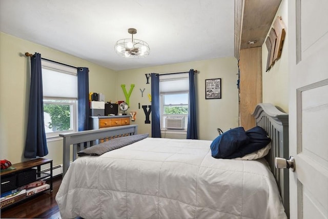 33 Argyle Rd Unit 33, Braintree, MA 02184 - bedroom featuring multiple windows, wood finished floors, cooling unit, and a chandelier