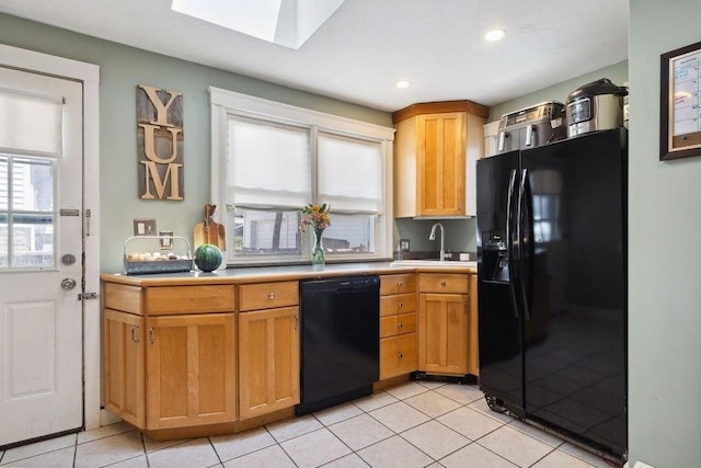 33 Argyle Rd Unit 33, Braintree, MA 02184 - kitchen featuring black appliances, a skylight, light countertops, light tile patterned flooring, and recessed lighting