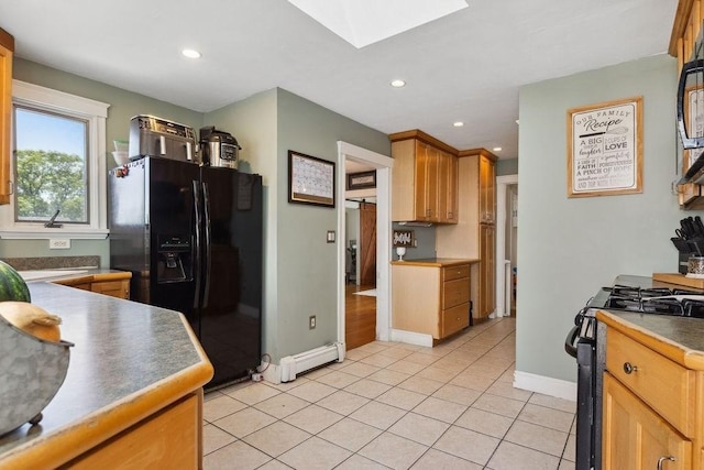 33 Argyle Rd Unit 33, Braintree, MA 02184 - kitchen featuring black appliances, a skylight, a baseboard radiator, light tile patterned floors, and recessed lighting