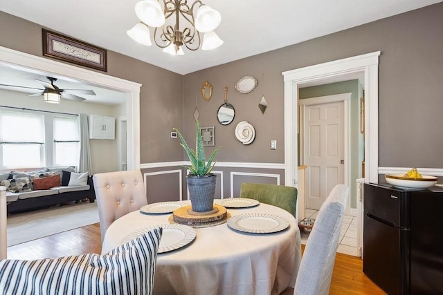 33 Argyle Rd Unit 33, Braintree, MA 02184 - dining room with a chandelier, wood finished floors, wainscoting, and ceiling fan