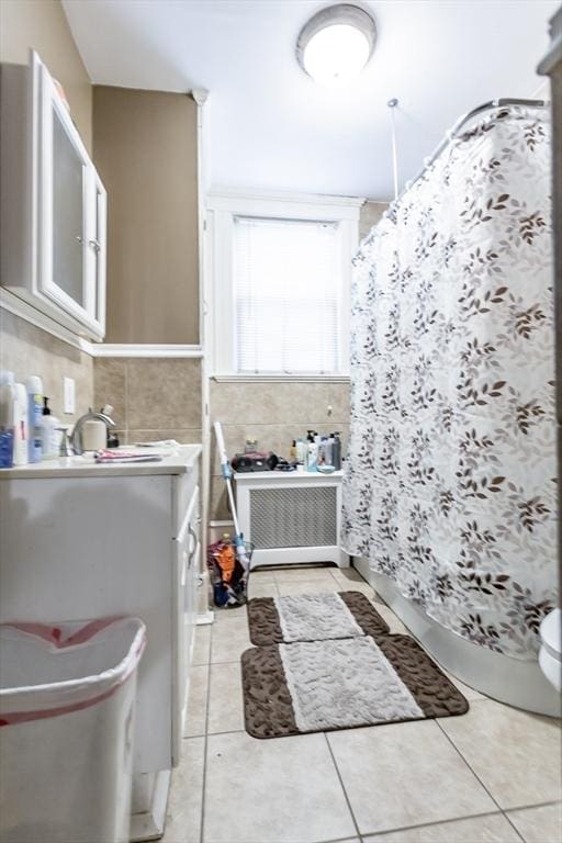 bathroom featuring tile walls, vanity, and tile patterned floors