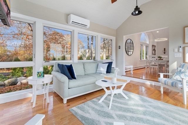 living room featuring high vaulted ceiling, a baseboard radiator, a wall mounted air conditioner, and light wood-type flooring