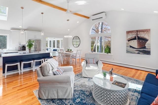 living room featuring ceiling fan, light hardwood / wood-style floors, baseboard heating, a wall mounted AC, and beam ceiling