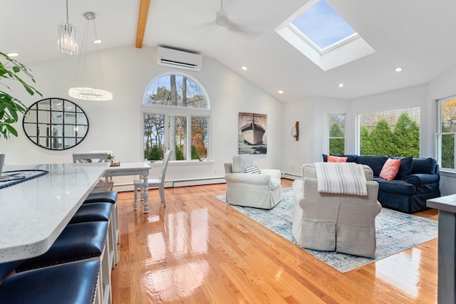 living room with an AC wall unit, light hardwood / wood-style flooring, ceiling fan, baseboard heating, and beam ceiling