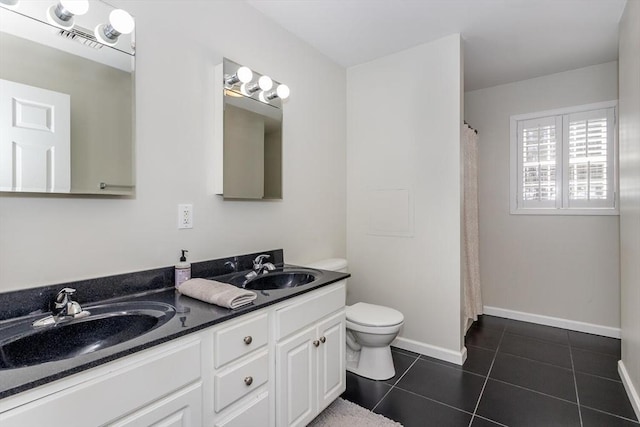 full bath with double vanity, tile patterned flooring, a sink, and toilet