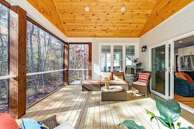 sunroom / solarium with vaulted ceiling and wood ceiling