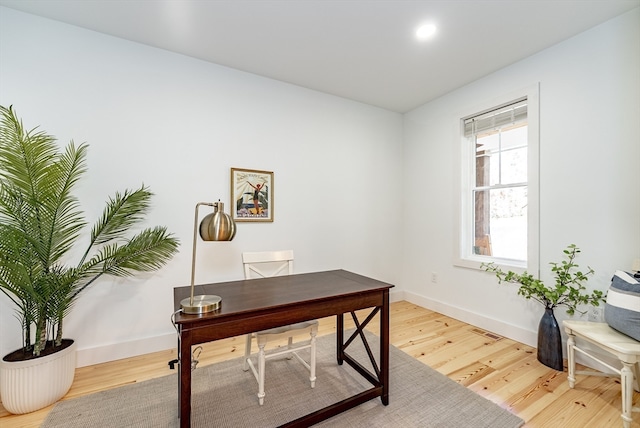 office space with hardwood / wood-style floors