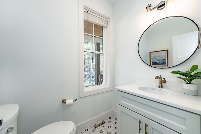 bathroom featuring vanity and toilet