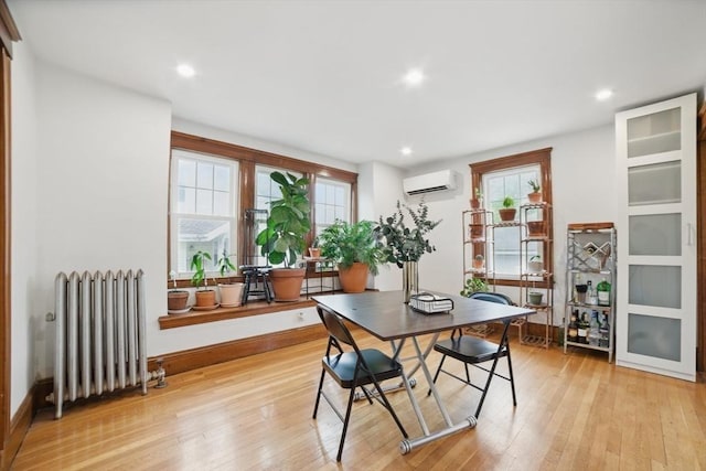 5 Ellington Rd, Quincy, MA 02171 - dining space featuring radiator, a wall mounted air conditioner, plenty of natural light, light wood-style flooring, and recessed lighting
