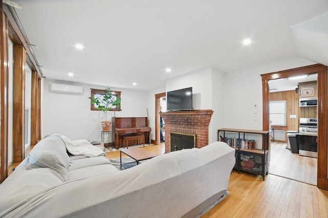 5 Ellington Rd, Quincy, MA 02171 - living area with an AC wall unit, light wood-type flooring, a fireplace, and recessed lighting