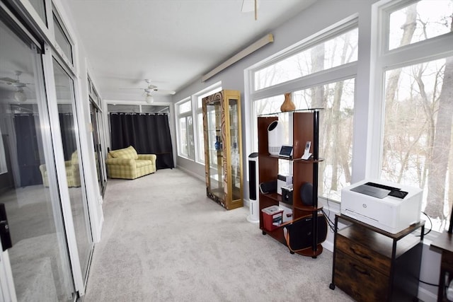 sunroom featuring french doors and ceiling fan