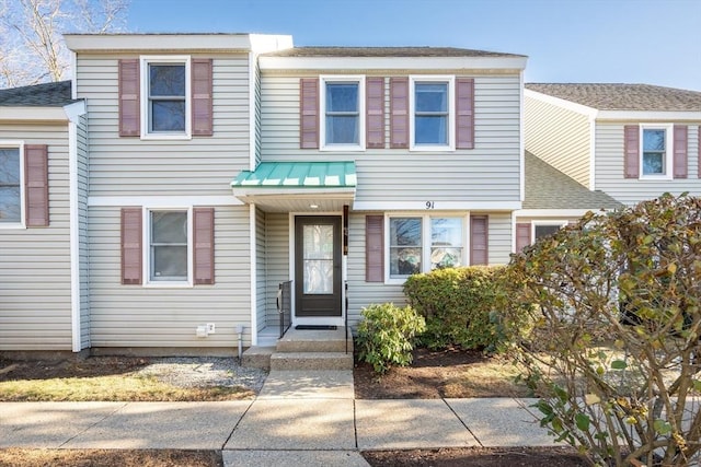 townhome / multi-family property featuring metal roof and a standing seam roof