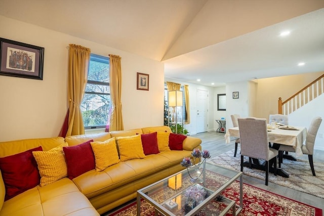 living area with stairs, vaulted ceiling, wood finished floors, and recessed lighting