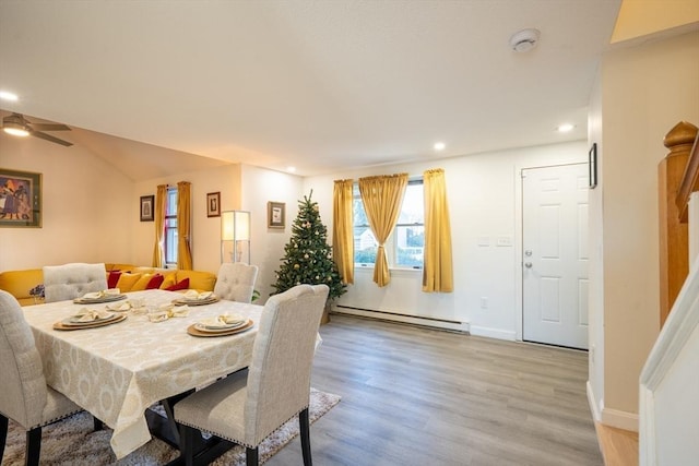 dining space featuring baseboards, a ceiling fan, a baseboard radiator, light wood-type flooring, and recessed lighting