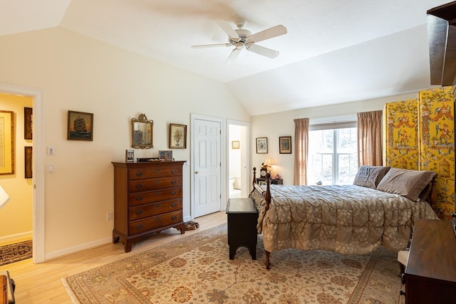 bedroom with vaulted ceiling, light hardwood / wood-style flooring, and ceiling fan