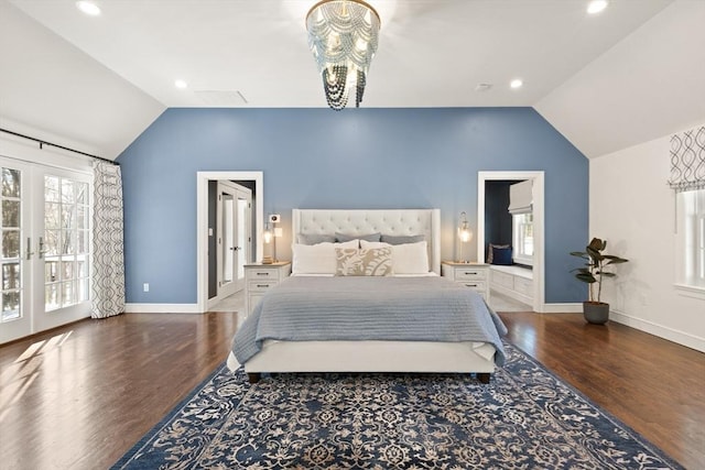 bedroom featuring vaulted ceiling, a chandelier, access to outside, dark wood-type flooring, and french doors