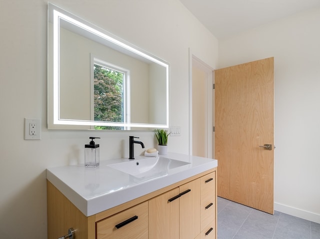 bathroom featuring tile flooring and vanity