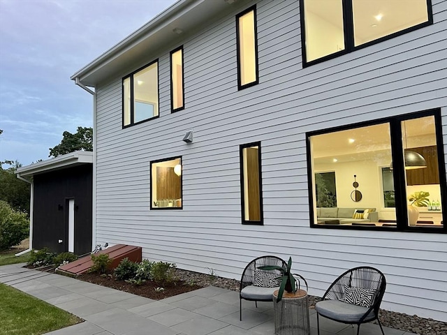 rear view of house featuring a patio