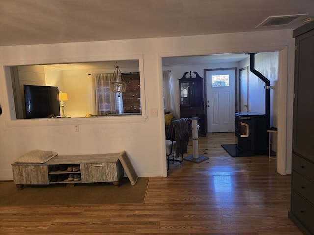 68 Lake Shore Dr, West Brookfield, MA 01585 - entrance foyer with wood finished floors and a wood stove