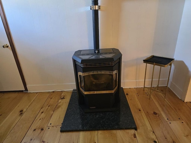 68 Lake Shore Dr, West Brookfield, MA 01585 - detailed view of a wood stove and wood finished floors