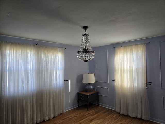 68 Lake Shore Dr, West Brookfield, MA 01585 - spare room with a chandelier and wood finished floors