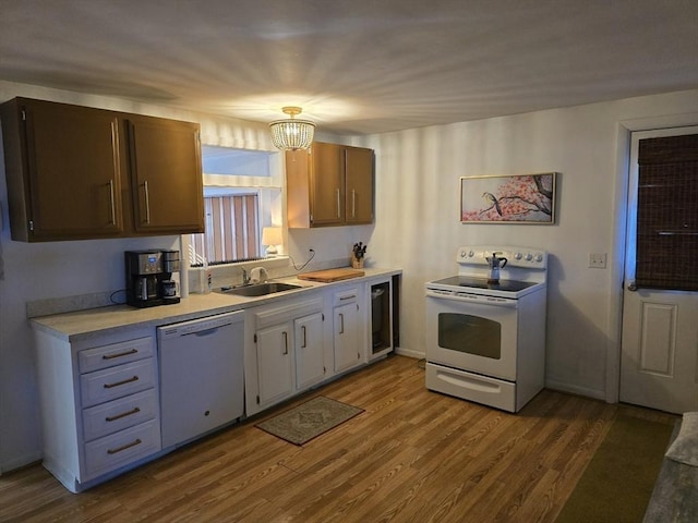 68 Lake Shore Dr, West Brookfield, MA 01585 - kitchen featuring white appliances, light countertops, and dark wood-style flooring