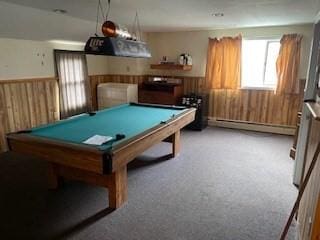 playroom featuring billiards table, a baseboard radiator, wainscoting, and wood walls